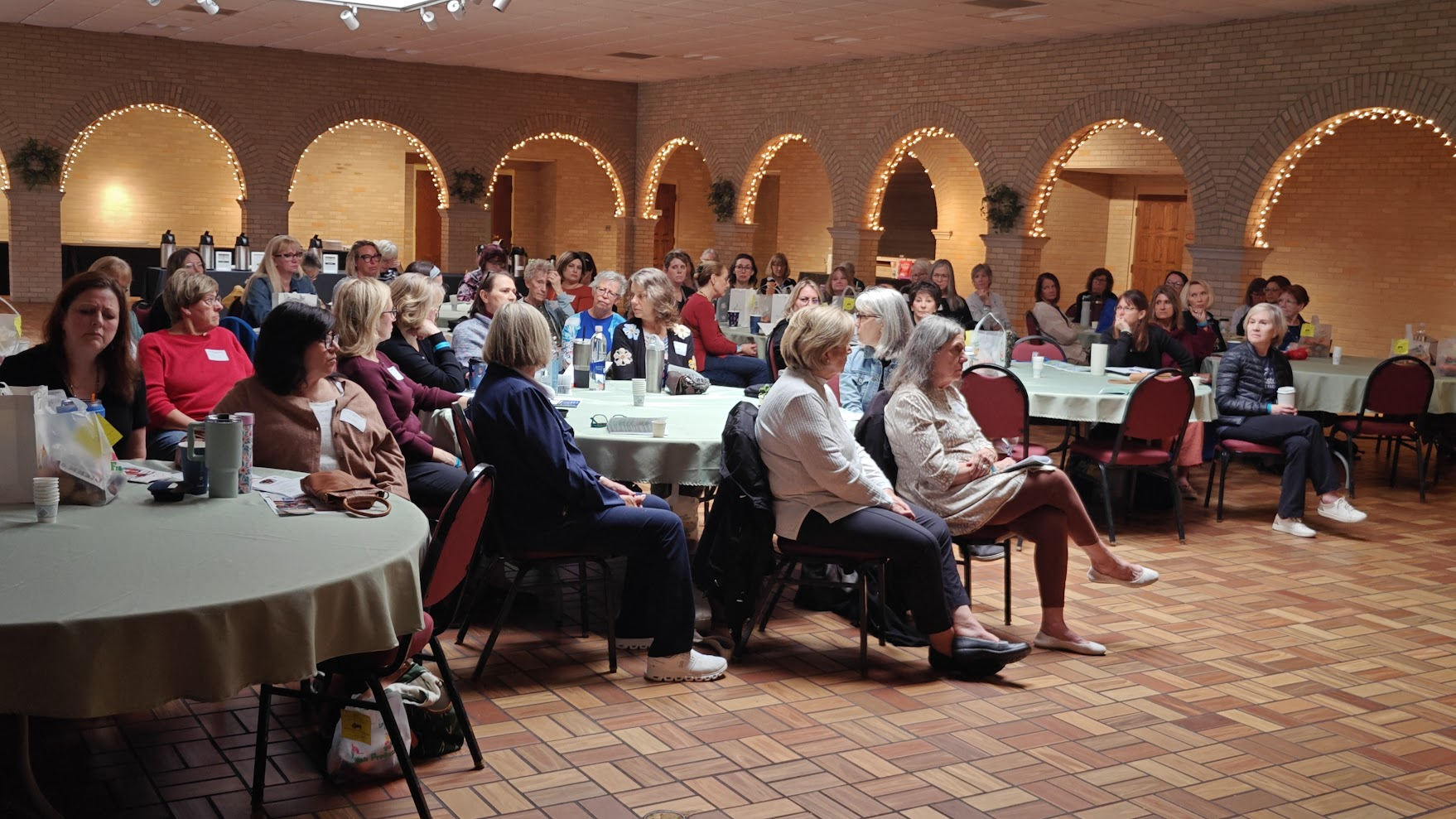 A gathered audience listening together at an event